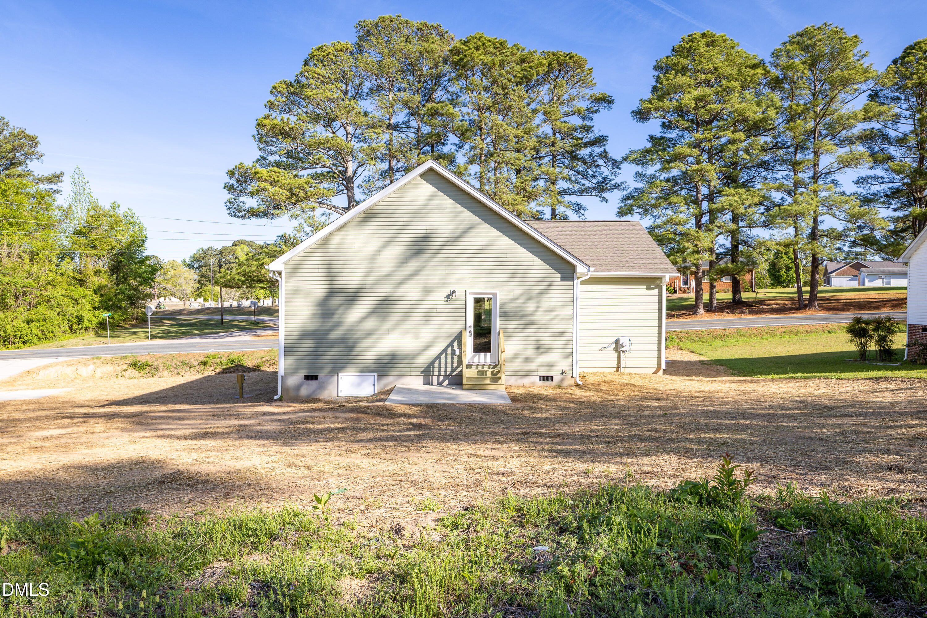 179 West Hamer Street Coats, NC 27521 - Photo 24 of 26 a view of a house with a backyard
