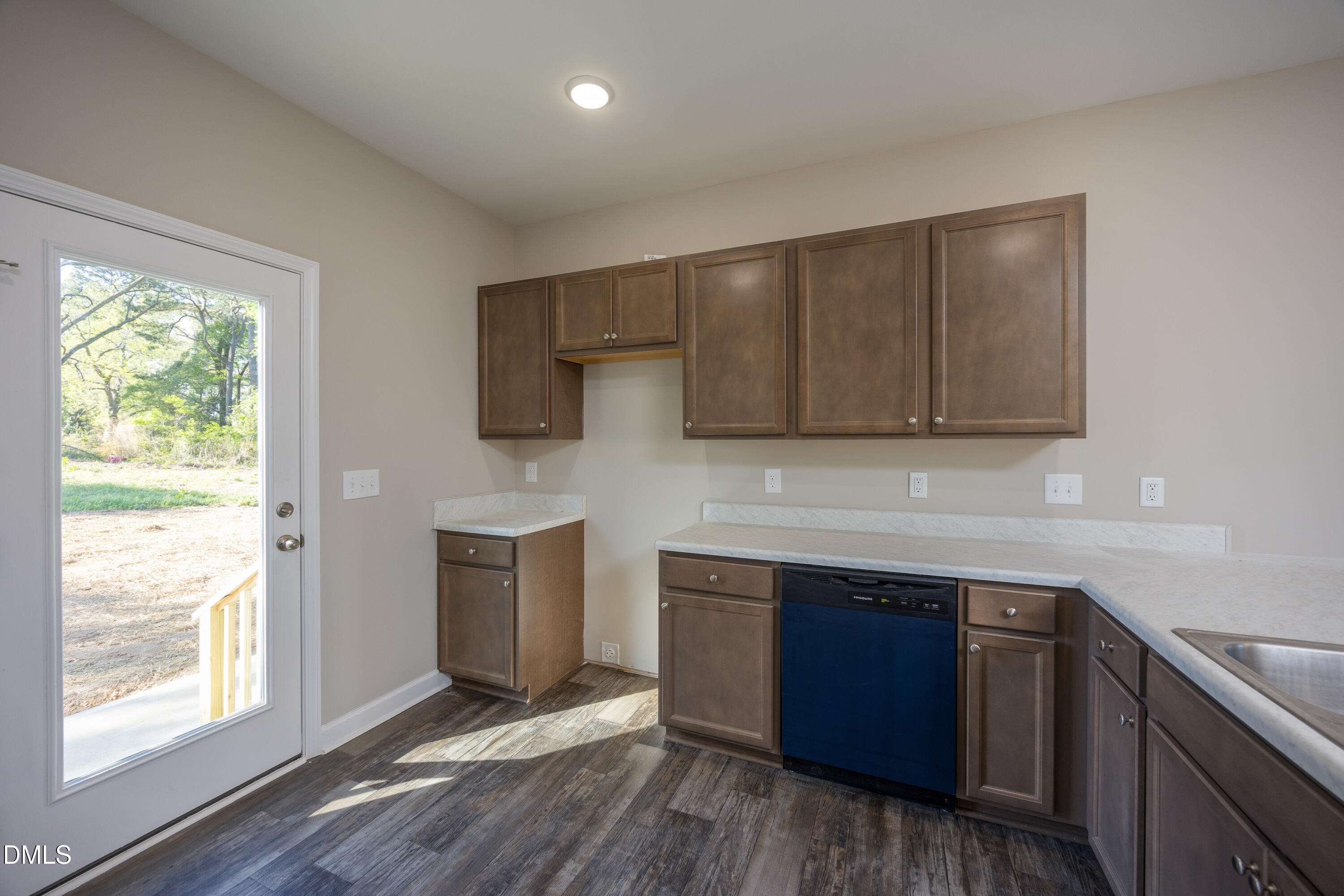 179 West Hamer Street Coats, NC 27521 - Photo 9 of 26 a kitchen with stainless steel appliances granite countertop a stove a sink and a microwave