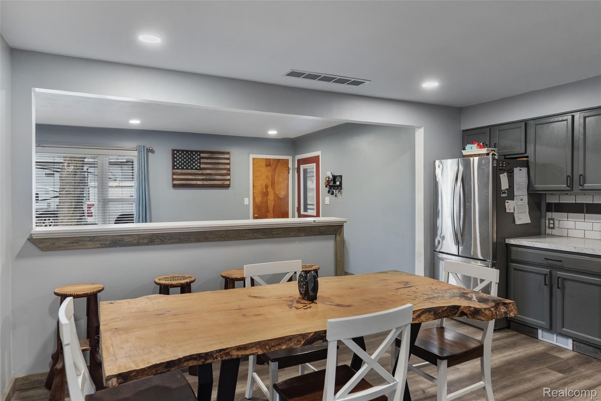 8150 Davison Road Davison, MI 48423 - Photo 8 of 25 Dining area with dark wood-type flooring and recessed lighting