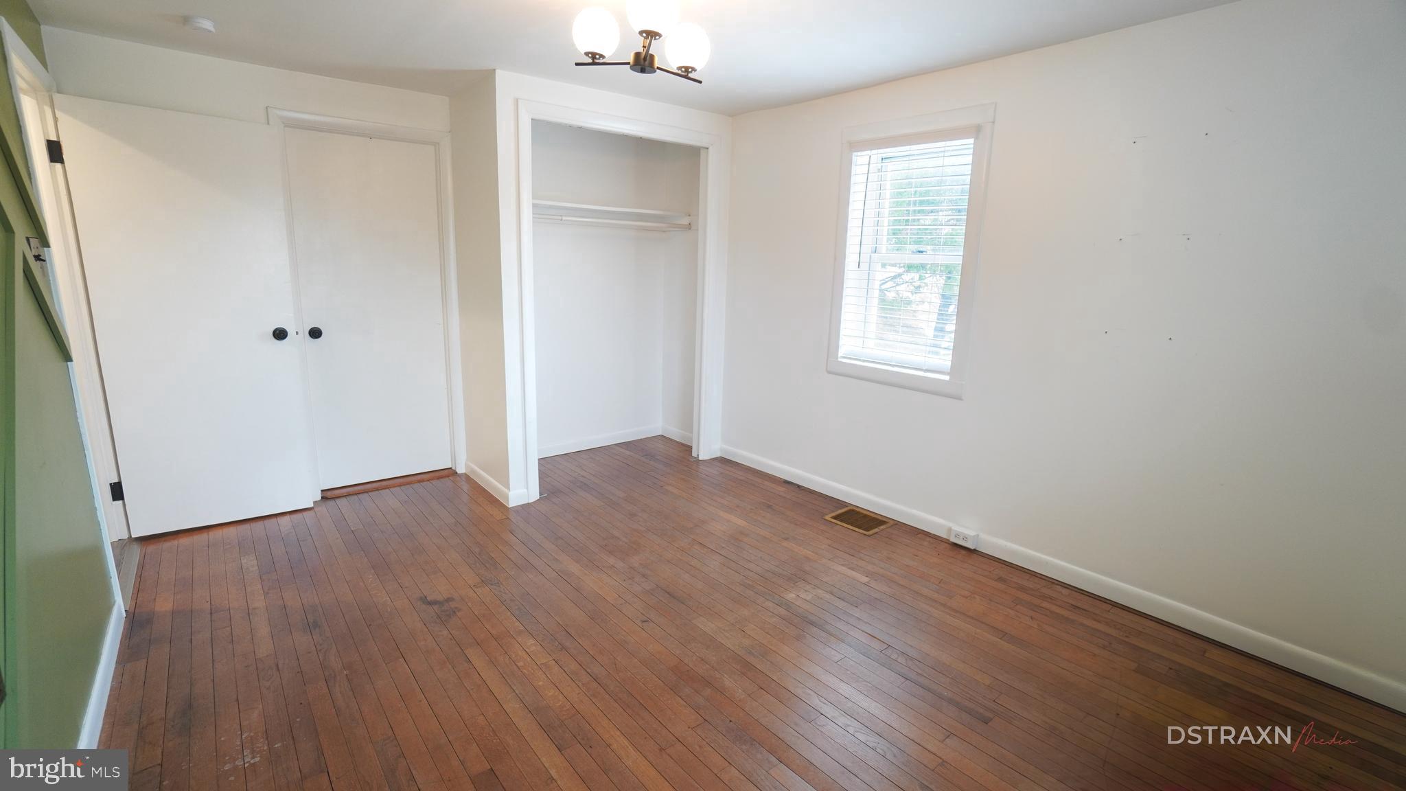 3708 Limekiln Road Sharpsburg, MD 21782 - Photo 22 of 33 an empty room with wooden floor and windows