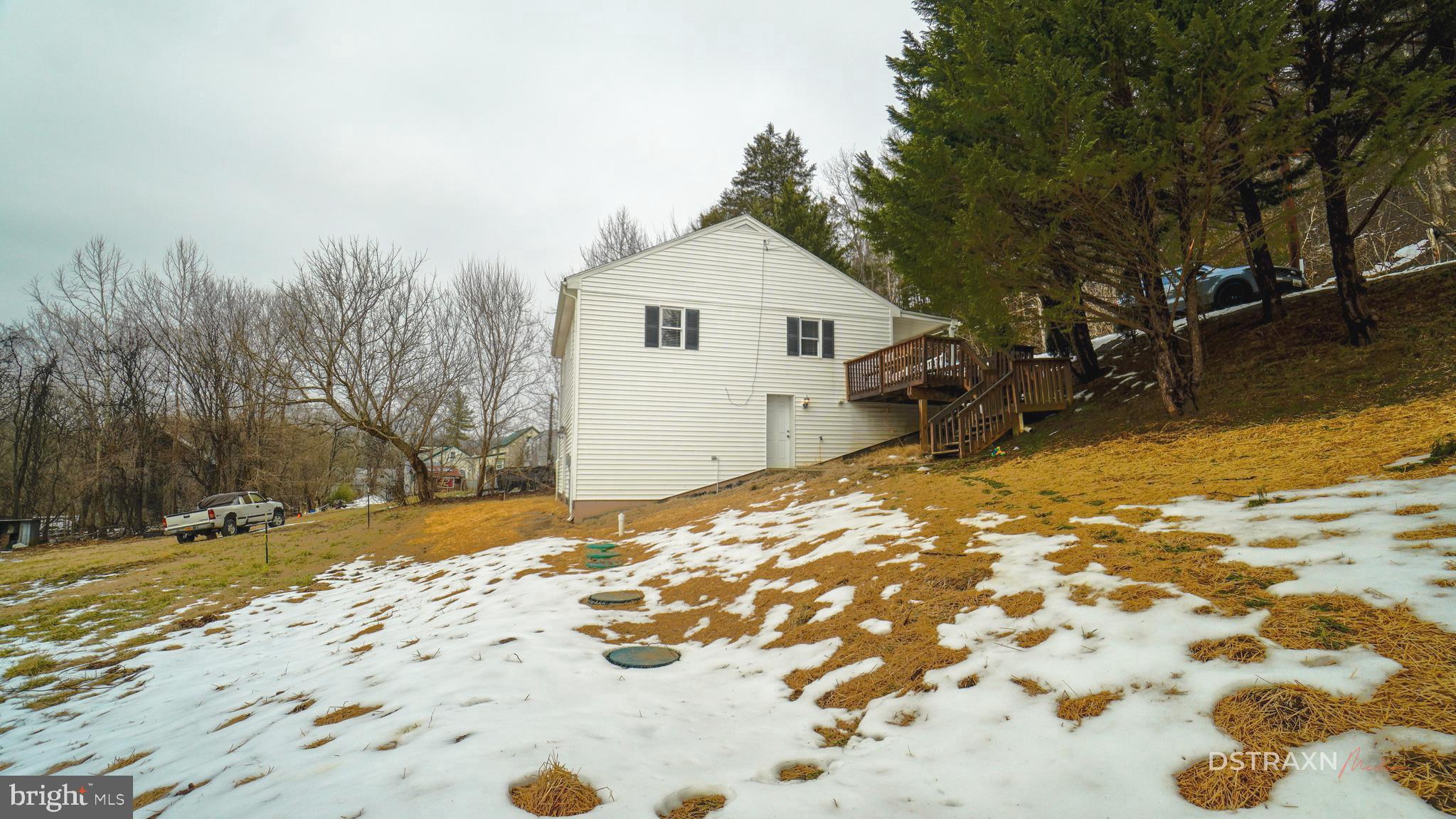 3708 Limekiln Road Sharpsburg, MD 21782 - Photo 4 of 33 a view of a backyard with snow on the road