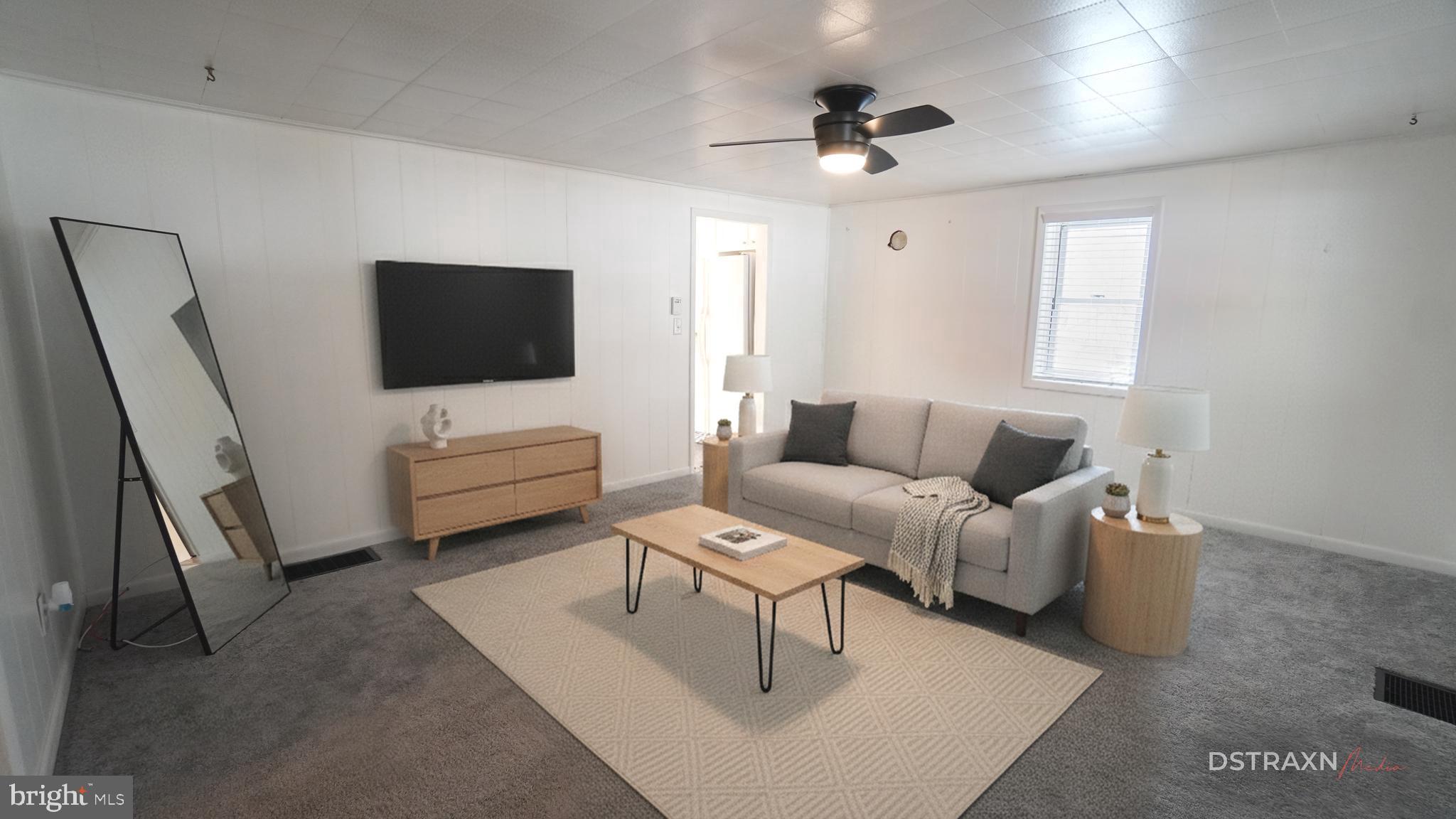 3708 Limekiln Road Sharpsburg, MD 21782 - Photo 9 of 33 a living room with furniture and a flat screen tv