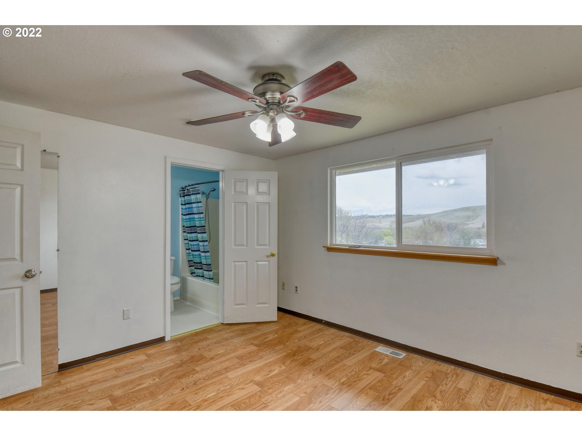 1816 Southwest 45th Street Pendleton, OR 97801 - Photo 11 of 32 a view of an empty room with a window
