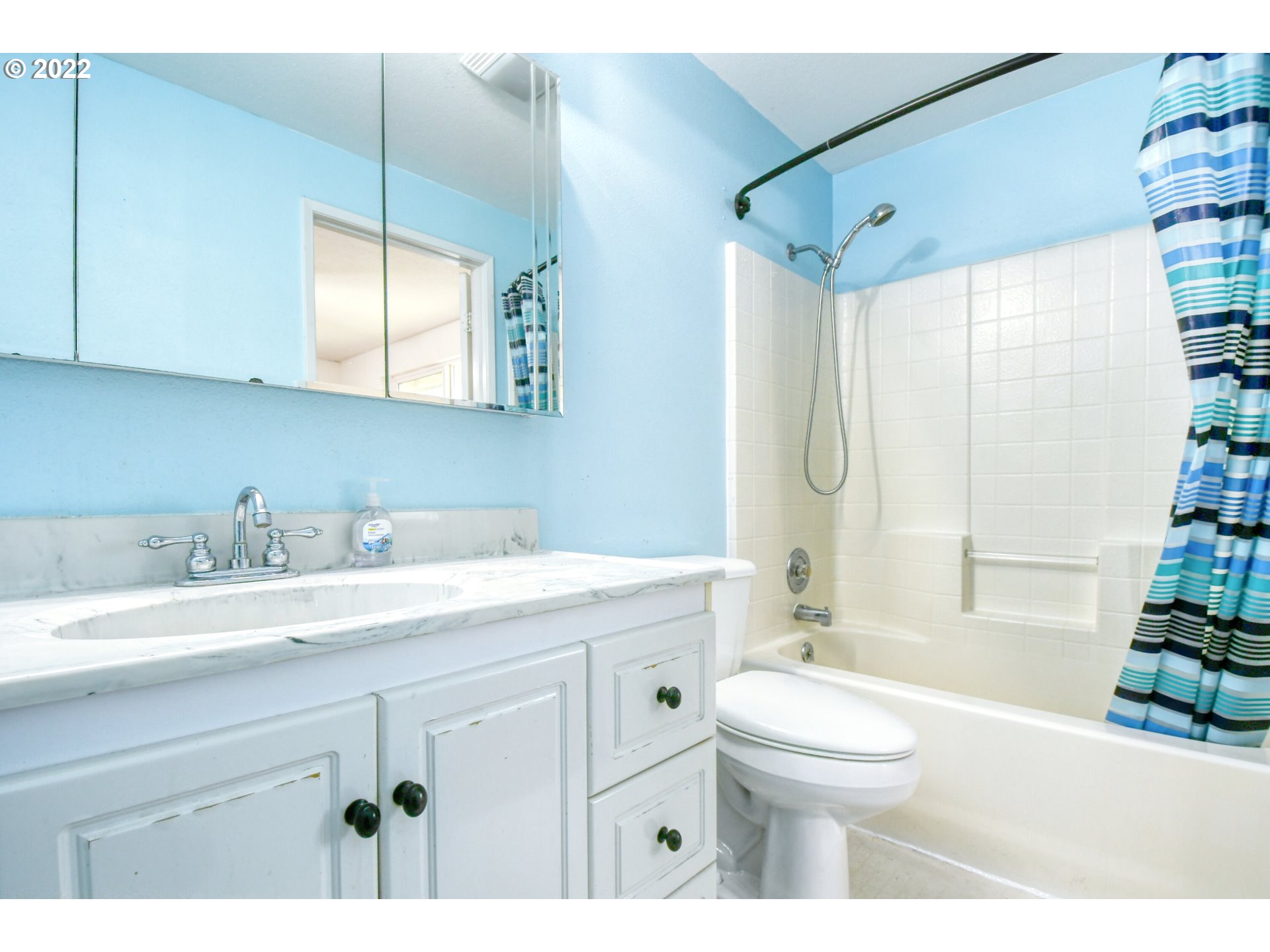 1816 Southwest 45th Street Pendleton, OR 97801 - Photo 14 of 32 a bathroom with a granite countertop sink mirror vanity and toilet