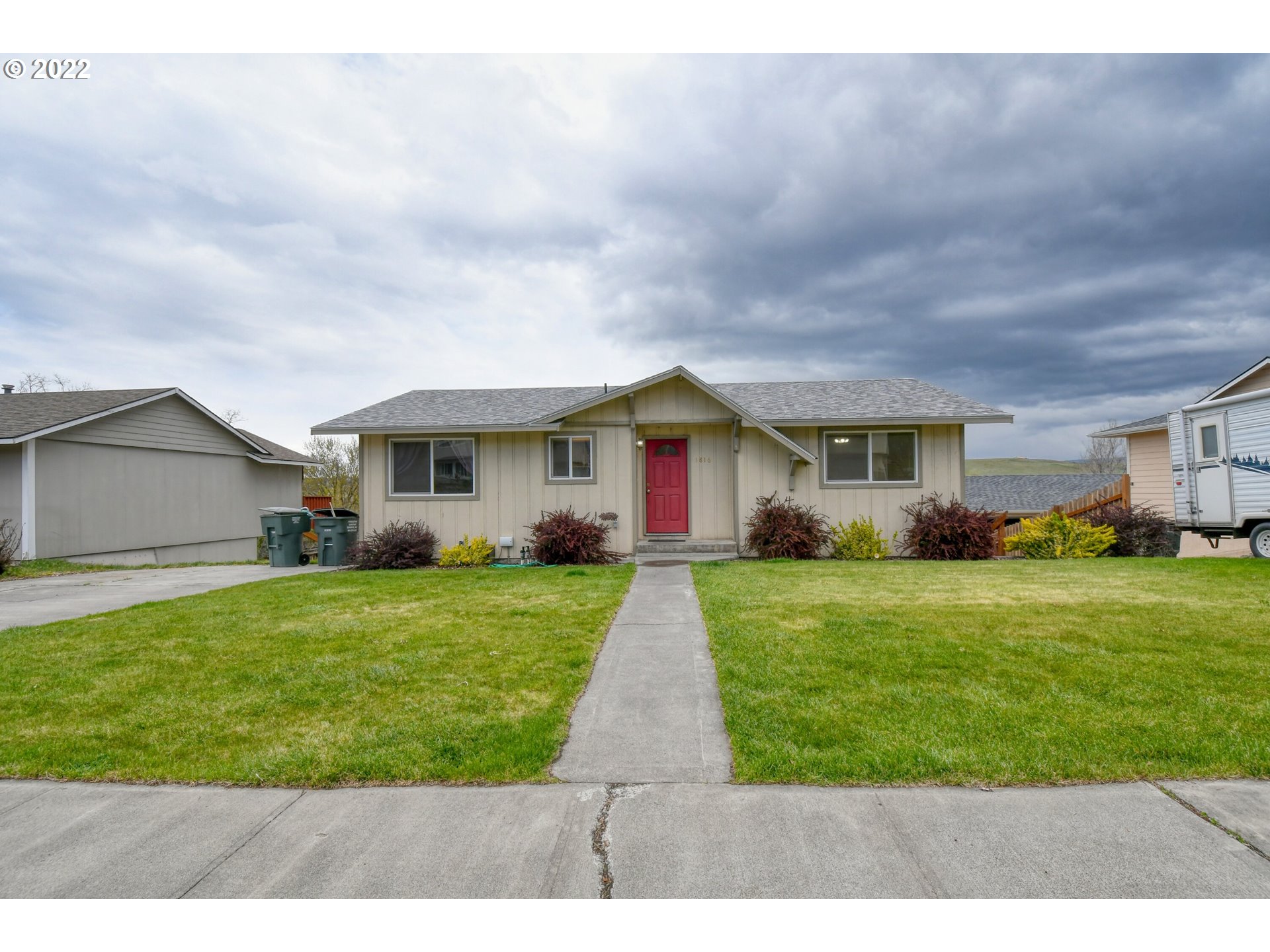 1816 Southwest 45th Street Pendleton, OR 97801 - Photo 2 of 32 a front view of a house with a yard and garage