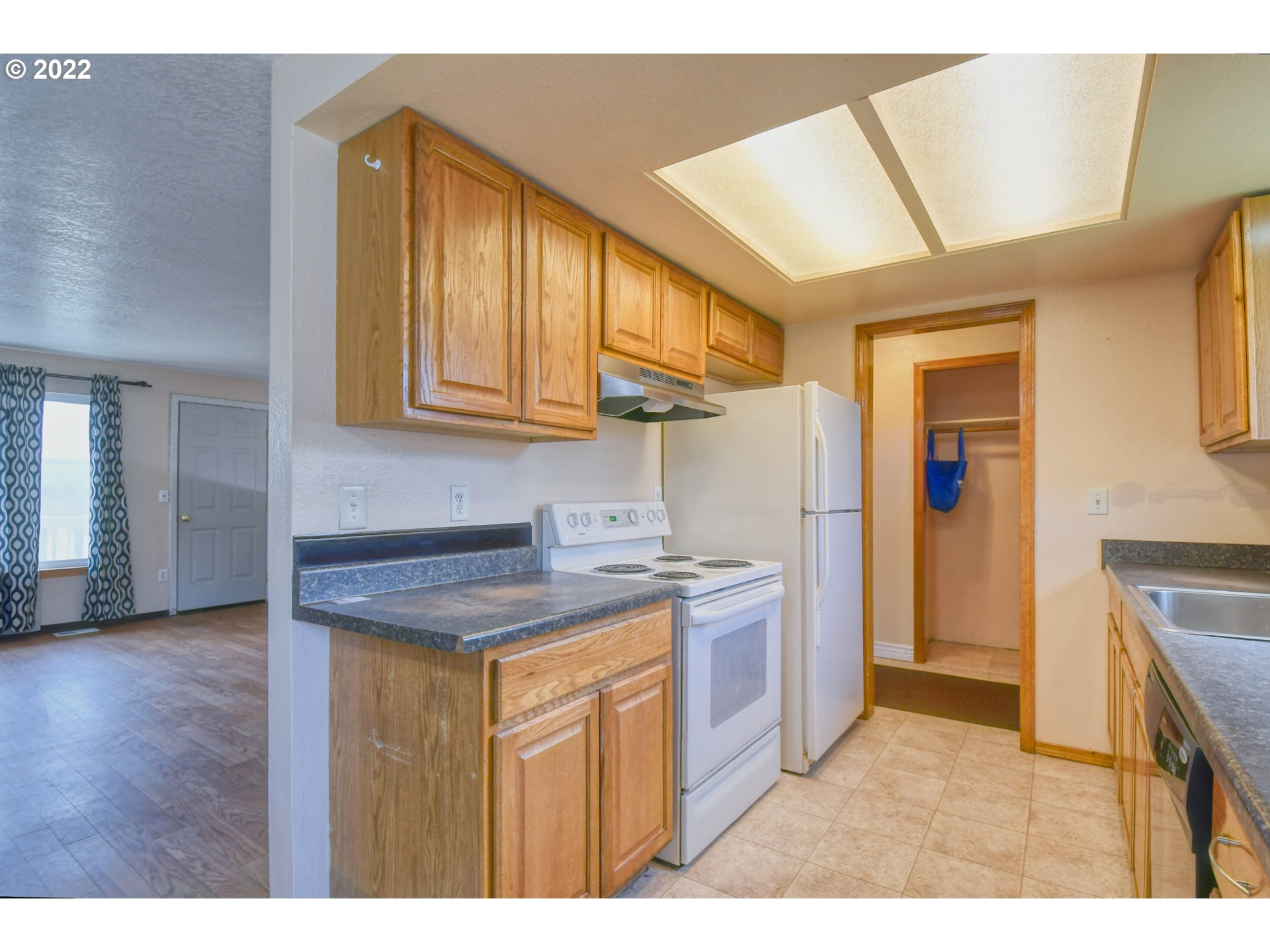 1816 Southwest 45th Street Pendleton, OR 97801 - Photo 10 of 32 a kitchen with stainless steel appliances granite countertop a sink and cabinets