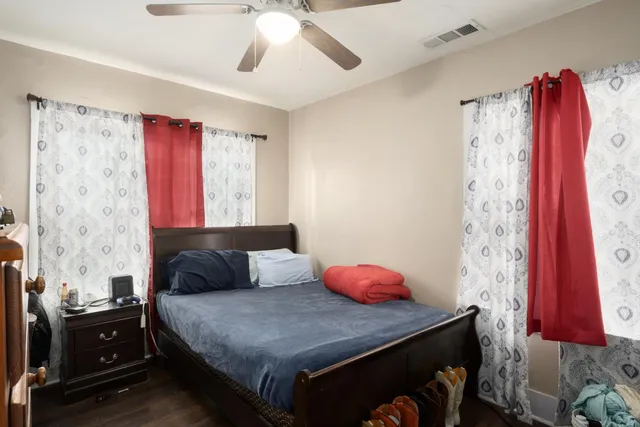 a bedroom with a bed and a dresser