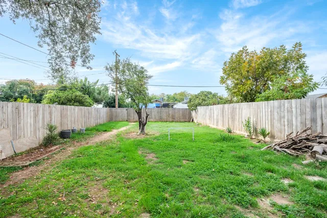 a backyard of a house with lots of green space