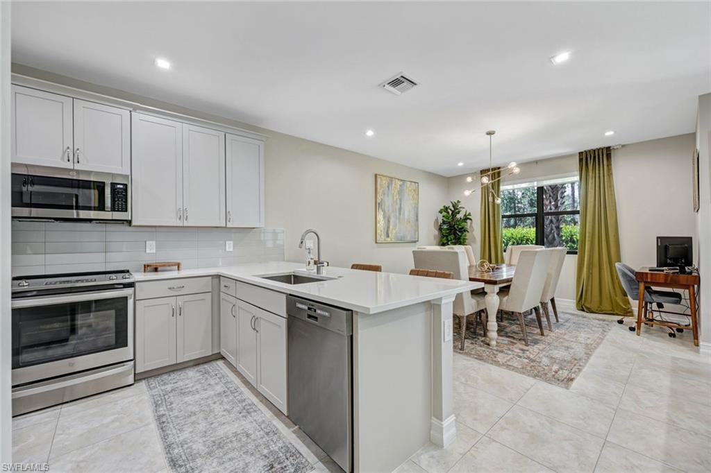 7348 Rockefeller Drive Naples, FL 34119 - Photo 11 of 39 Kitchen and Dining Area