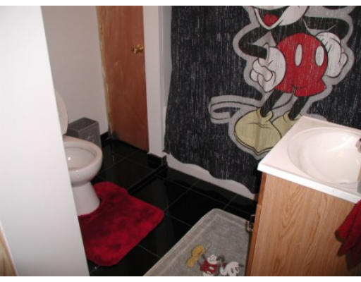 28 Gladstone Street Springfield, MA 01109 - Photo 10 of 13 a bathroom with a toilet and a mirror