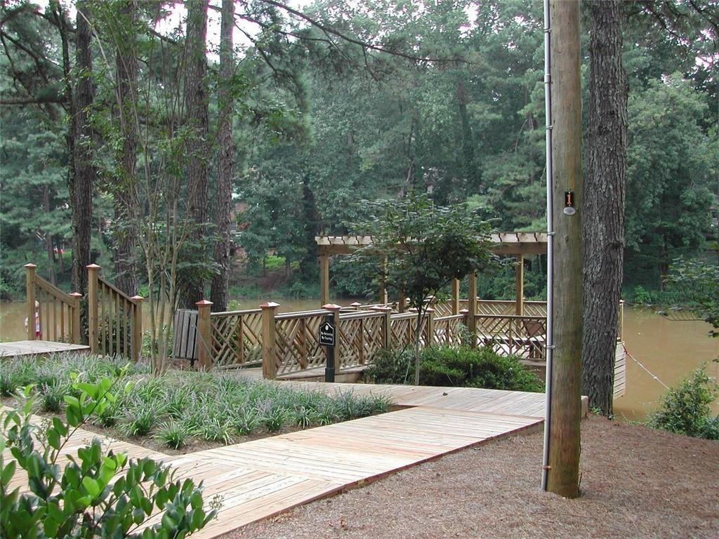 3650 Ashford Dunwoody Road Northeast, Unit 918 Atlanta, GA 30319 - Photo 14 of 17 a view of a park with iron fence