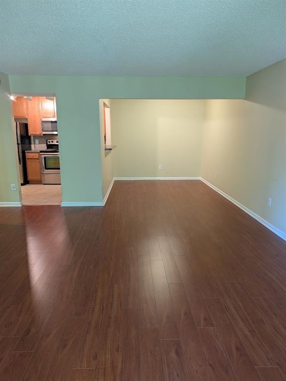 3650 Ashford Dunwoody Road Northeast, Unit 918 Atlanta, GA 30319 - Photo 4 of 17 a view of a livingroom with wooden floor