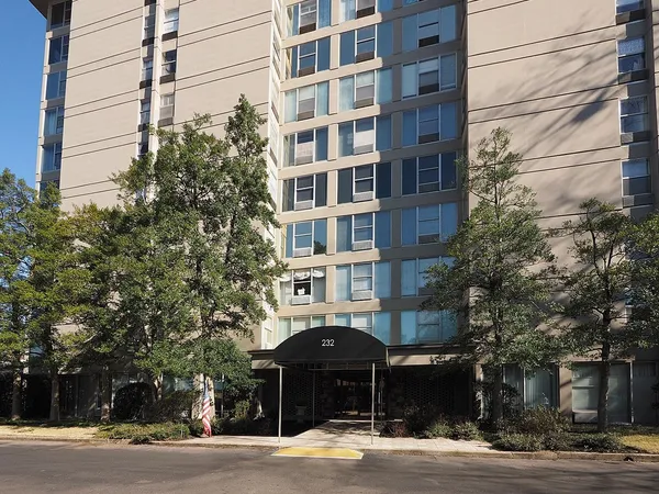 a front view of a building and a yard