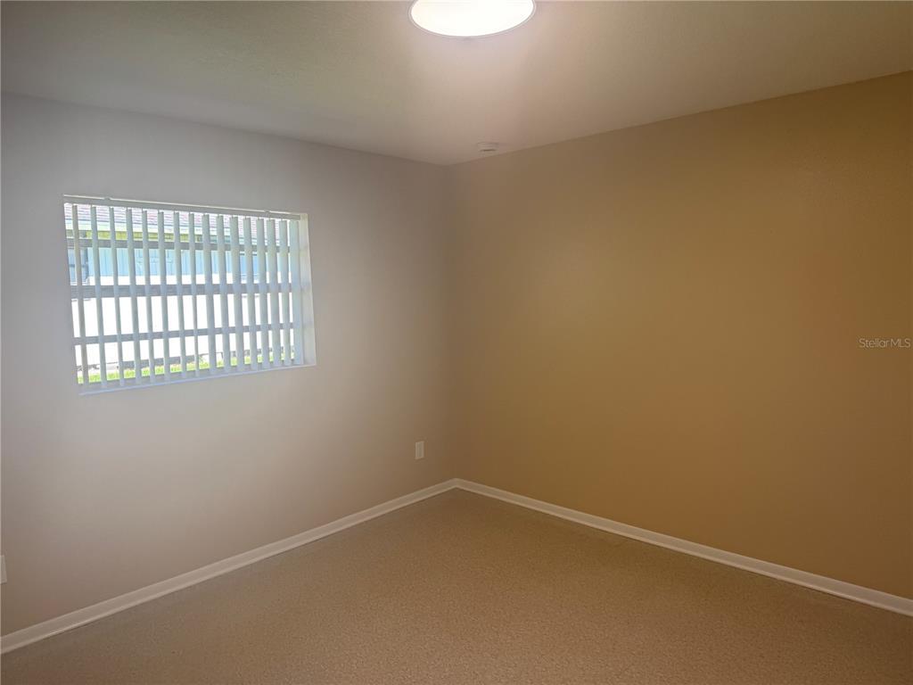 5222 Bogdonoff Drive, Unit A Seffner, FL 33584 - Photo 13 of 16 an empty room with a window
