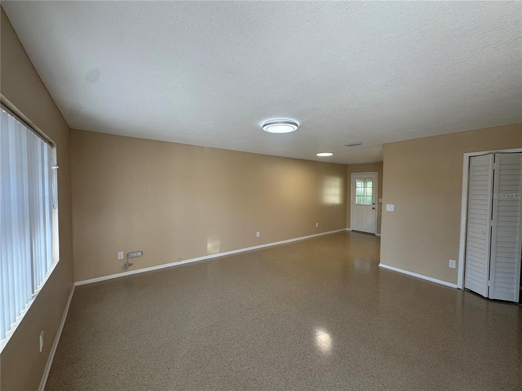 5222 Bogdonoff Drive, Unit A Seffner, FL 33584 - Photo 2 of 16 en empty room with windows and closet