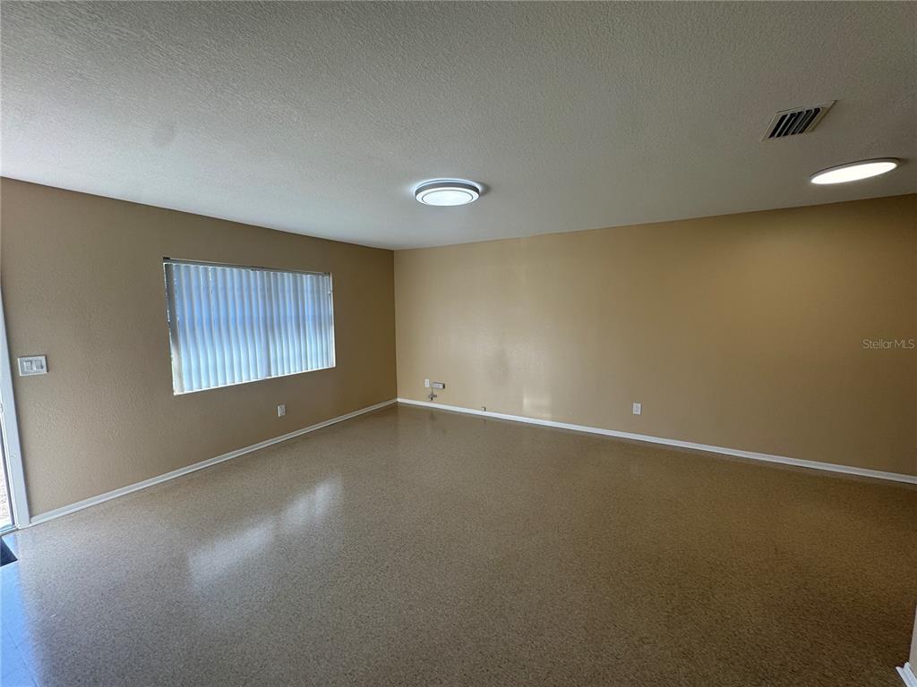 5222 Bogdonoff Drive, Unit A Seffner, FL 33584 - Photo 3 of 16 a view of an empty room with a window