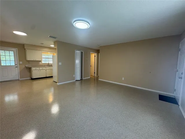 an empty room with a empty space and window