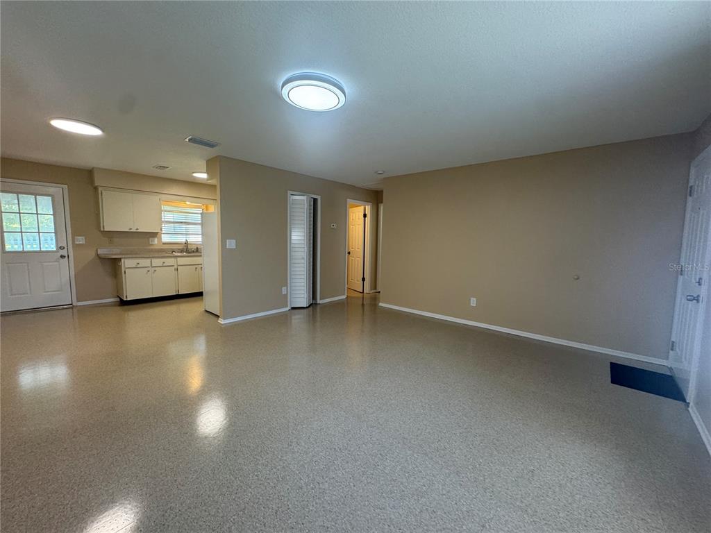 5222 Bogdonoff Drive, Unit A Seffner, FL 33584 - Photo 4 of 16 an empty room with a empty space and window