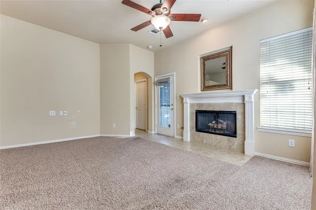 a view of a livingroom with a chandelier fan