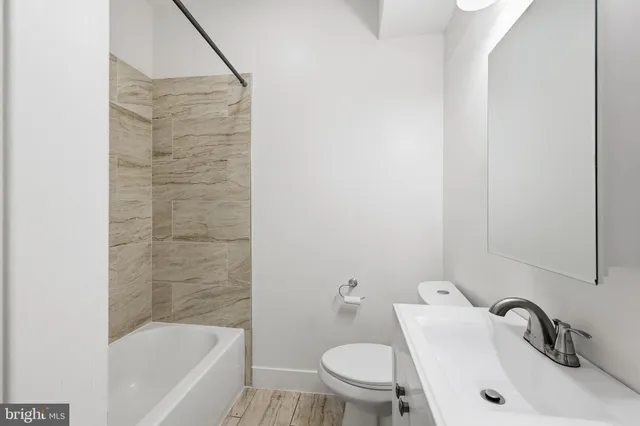 a bathroom with a sink and bathtub