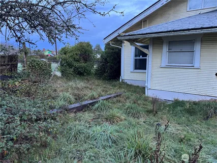 a view of a barn house in the middle of a yard