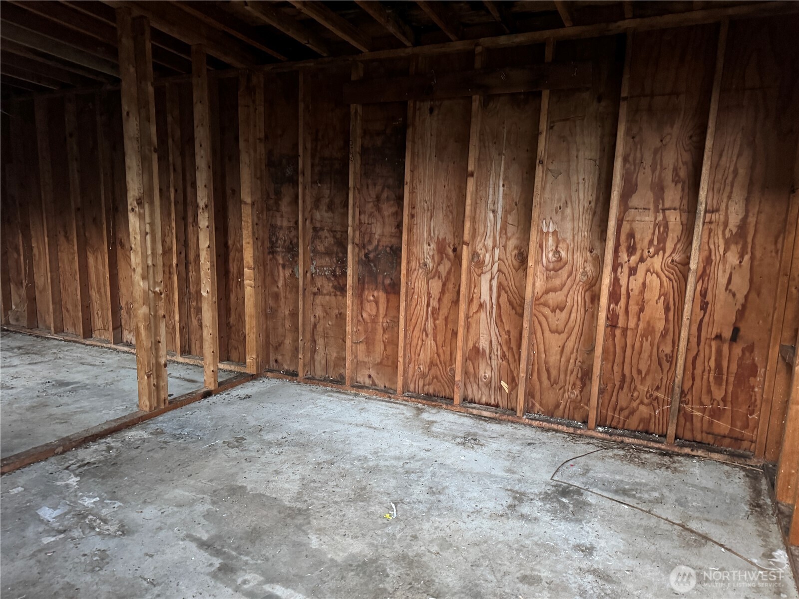 126 West 5th Street Port Angeles, WA 98362 - Photo 29 of 34 a view of an empty room with wooden walls