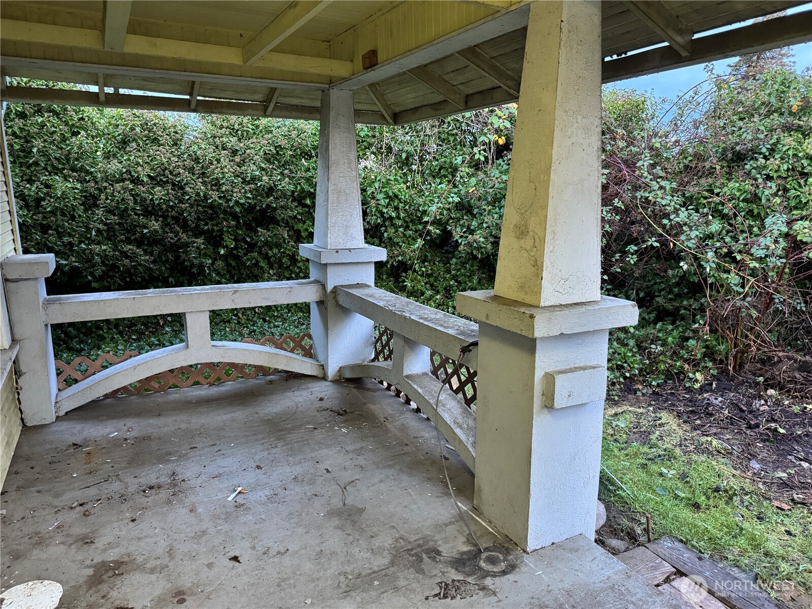 126 West 5th Street Port Angeles, WA 98362 - Photo 4 of 34 a view of a porch with a yard