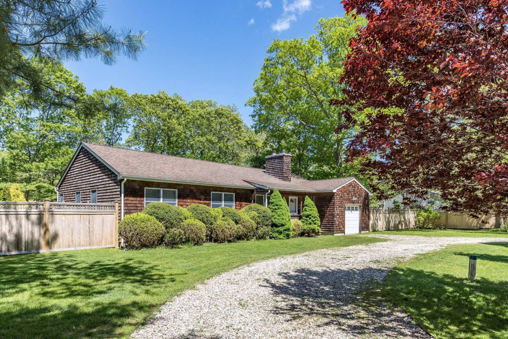 41 Sandra Road East Hampton, NY 11937 - Photo 2 of 16 a front view of a house with a yard