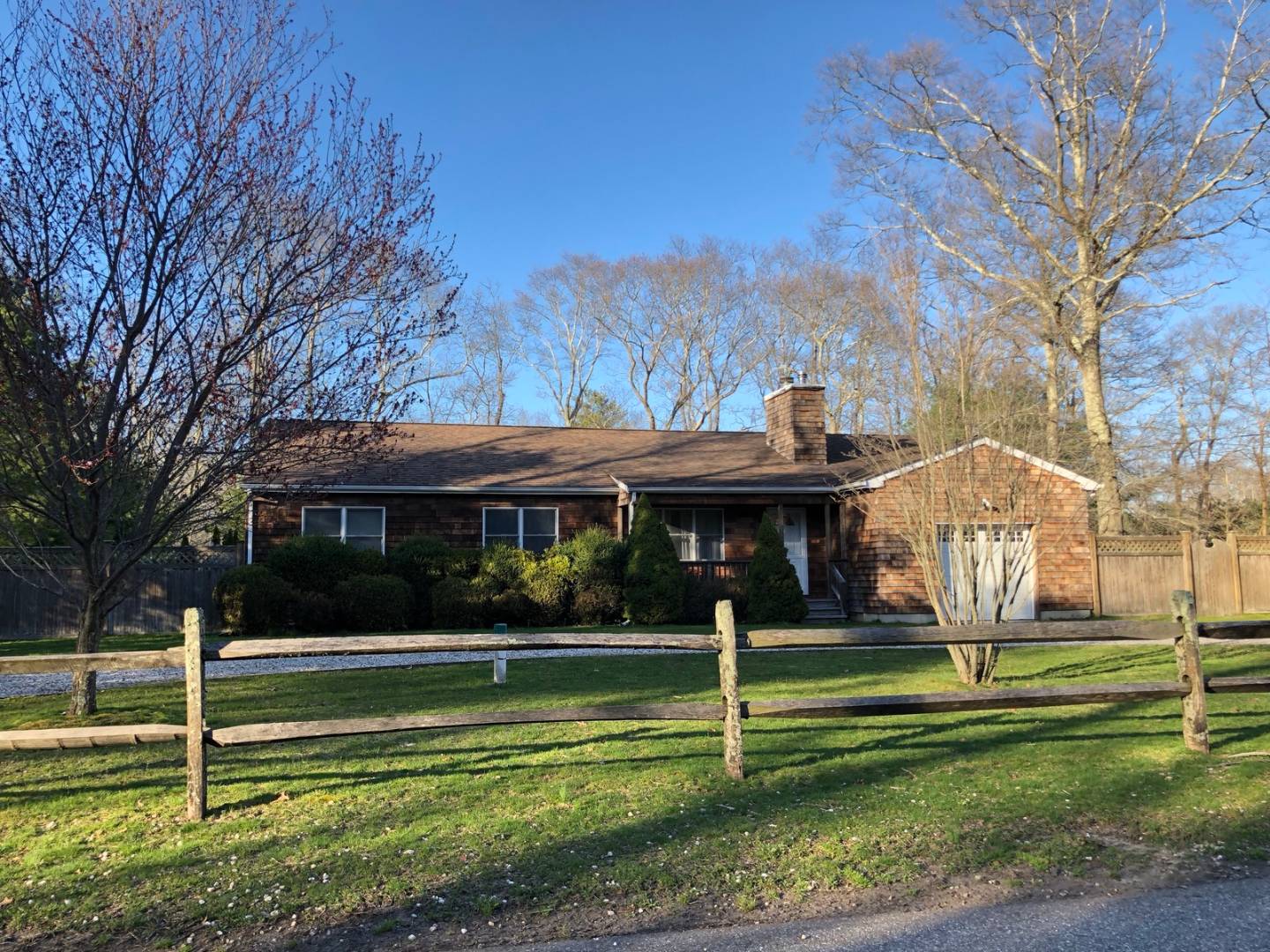 41 Sandra Road East Hampton, NY 11937 - Photo 13 of 16 a front view of a house with a yard