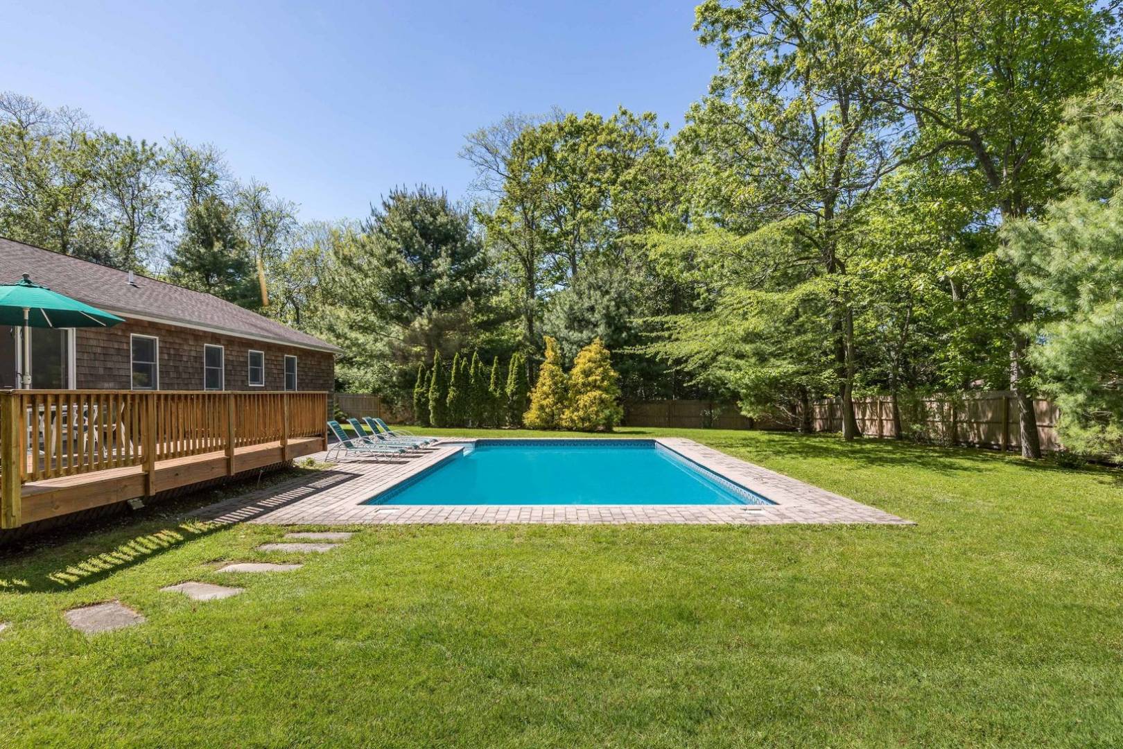 41 Sandra Road East Hampton, NY 11937 - Photo 4 of 16 a view of swimming pool with lawn chairs and plants