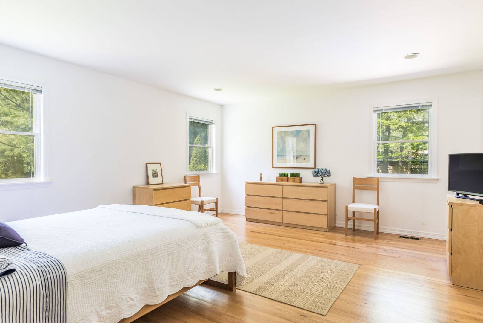 41 Sandra Road East Hampton, NY 11937 - Photo 7 of 16 a bedroom with a bed and a large window