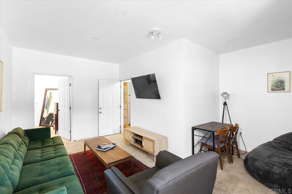 40707 Intrepid Road Hemet, CA 92544 - Photo 20 of 71 a living room with furniture and a flat screen tv