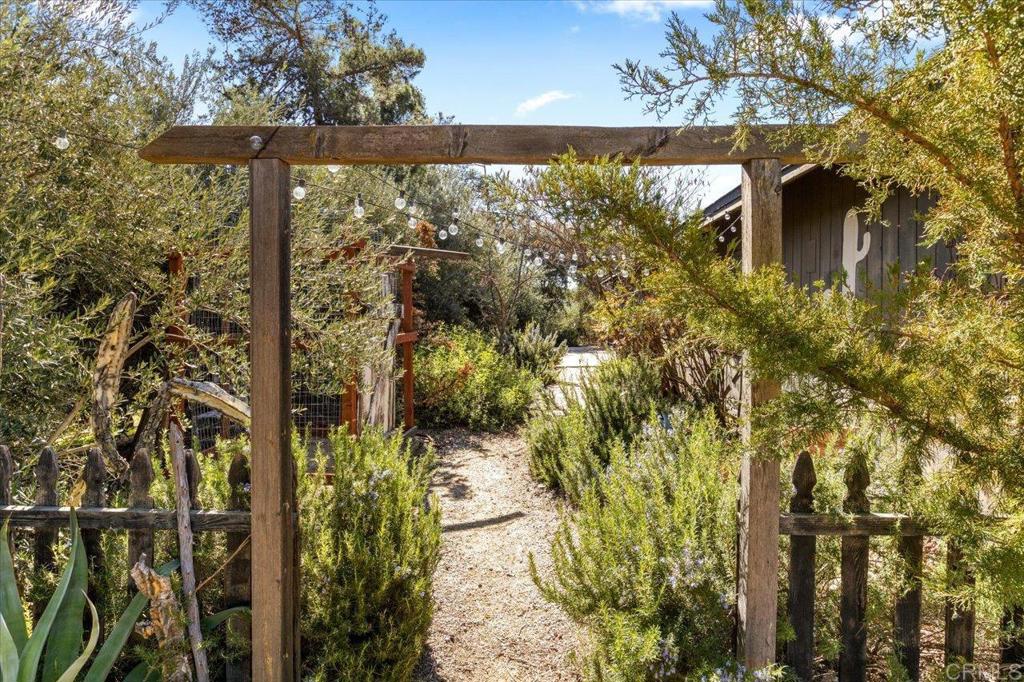 40707 Intrepid Road Hemet, CA 92544 - Photo 2 of 71 a view of a house with a tree in the background