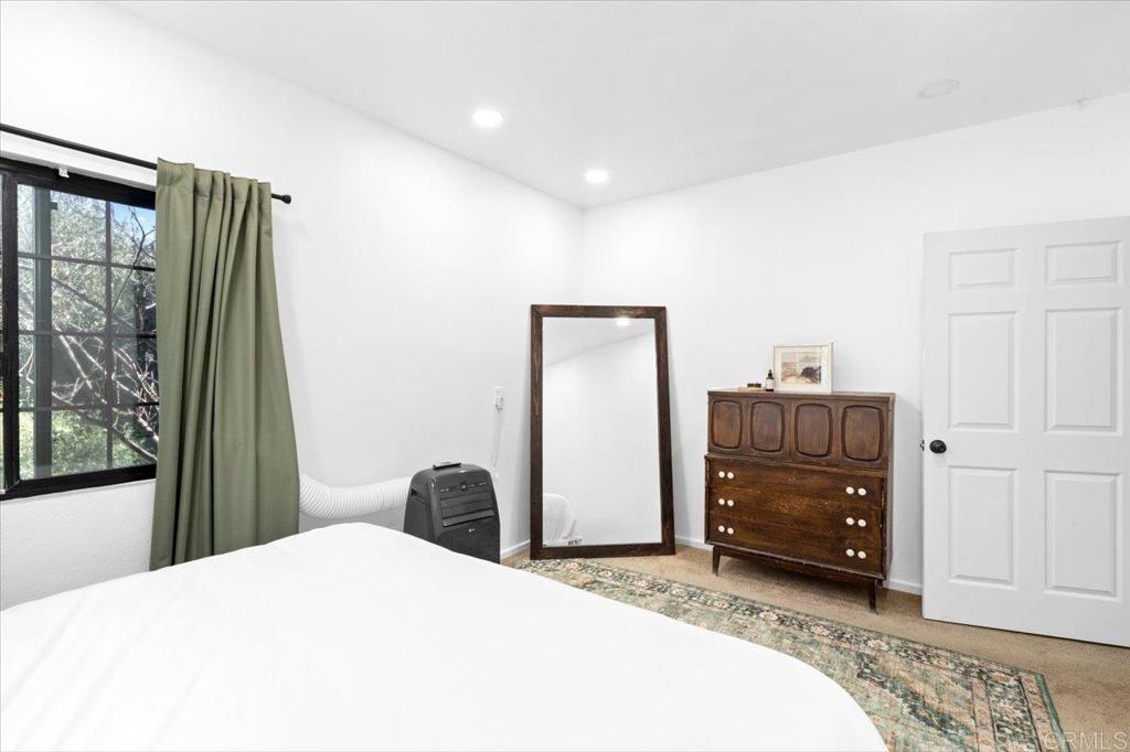 40707 Intrepid Road Hemet, CA 92544 - Photo 22 of 71 a bedroom with a bed and a window