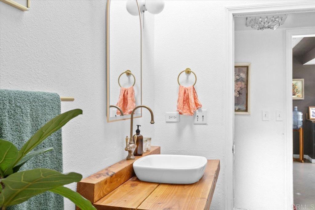 40707 Intrepid Road Hemet, CA 92544 - Photo 25 of 71 a bathroom with a sink mirror and toilet