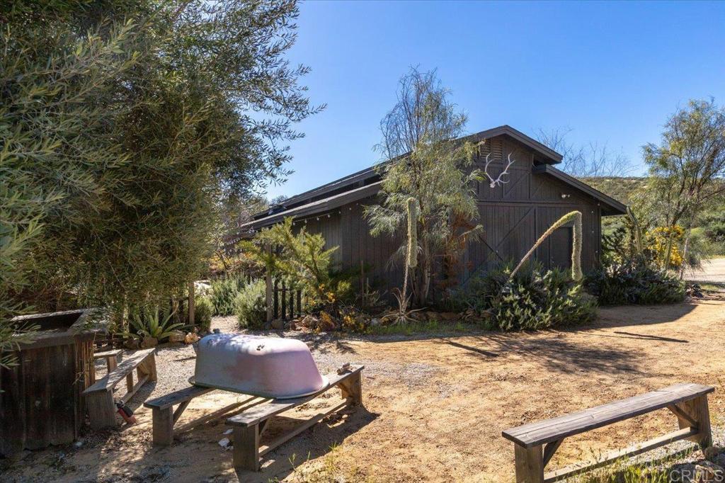 40707 Intrepid Road Hemet, CA 92544 - Photo 37 of 71 a backyard of a house with yard and outdoor seating