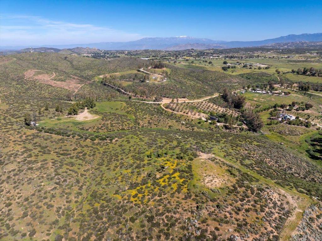 40707 Intrepid Road Hemet, CA 92544 - Photo 48 of 71 an aerial view of residential houses with outdoor space and mountain view