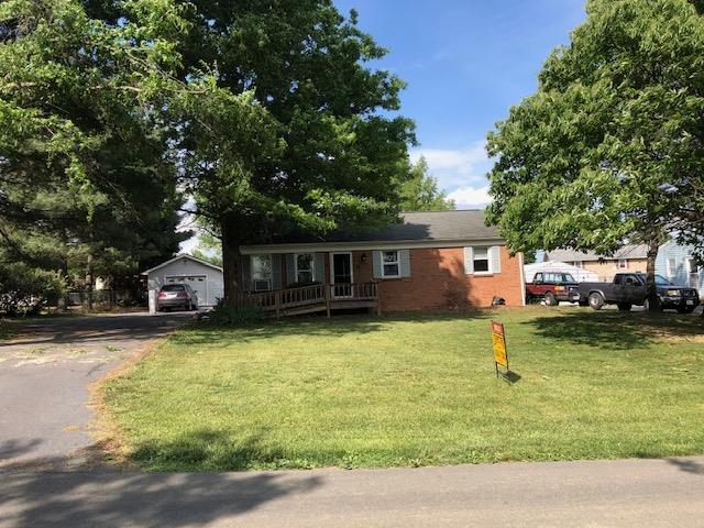 28 Gentry Road Weyers Cave, VA 24486 - Photo 1 of 2 a front view of a house with a yard table and chairs