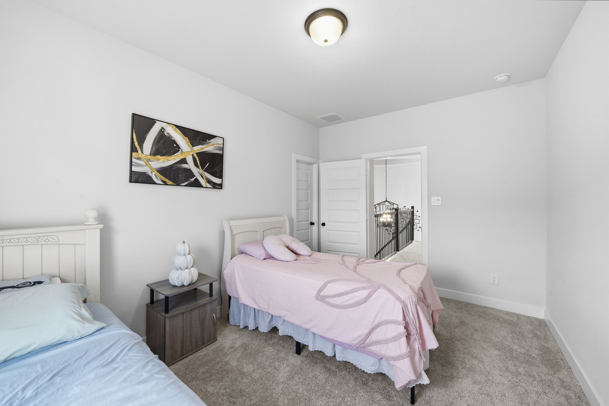 511 Carina Gaze Drive Conroe, TX 77318 - Photo 30 of 45 This bedroom features neutral walls, carpeted flooring.