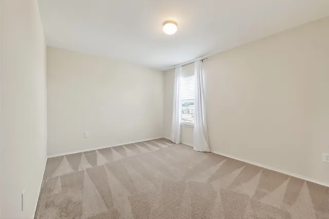 an empty room with a natural light