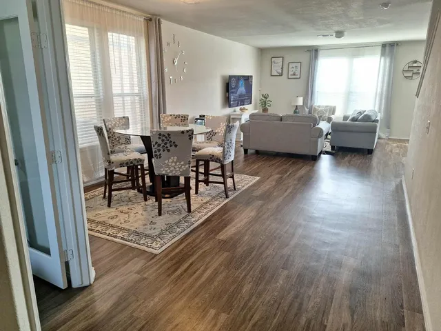 a view of a swimming pool and a yard