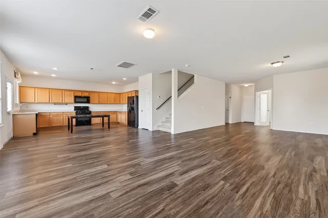 a view of kitchen with furniture and wooden floor