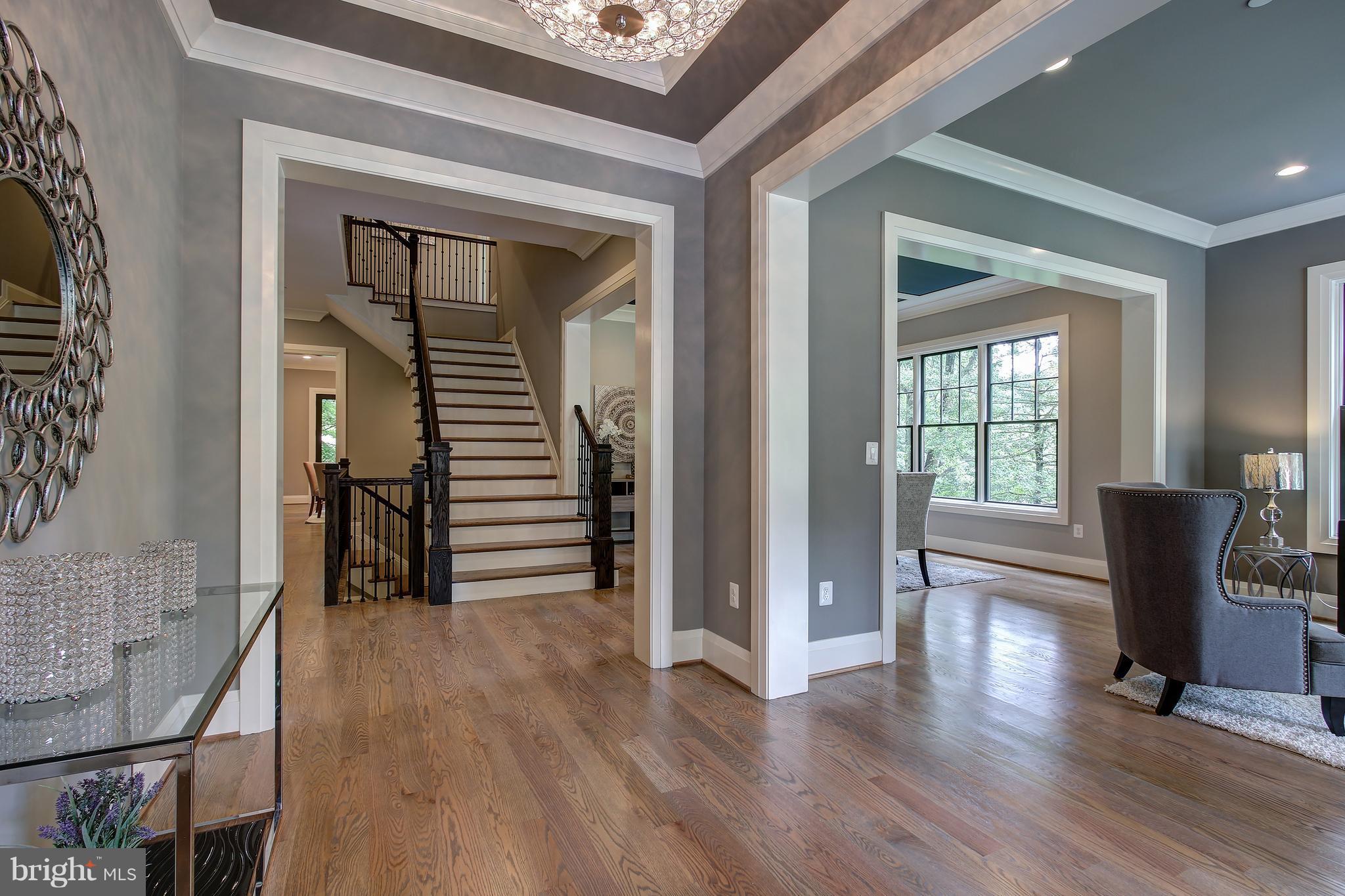 7005 Kenhill Road Bethesda, MD 20817 - Photo 3 of 24 a view of a livingroom with wooden floor and furniture