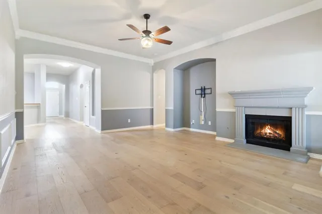 a view of an empty room with fire place and a fireplace