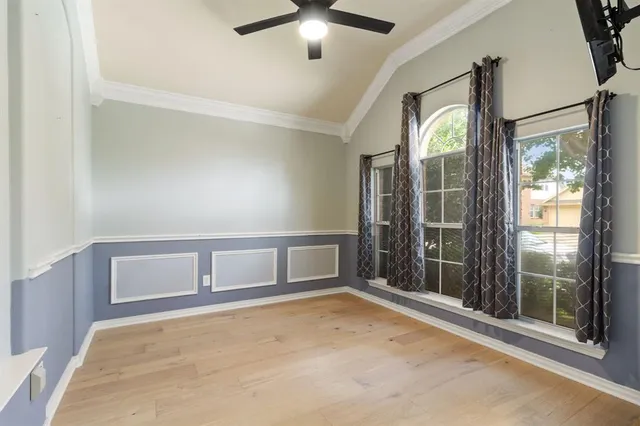 an empty room with windows and entrance