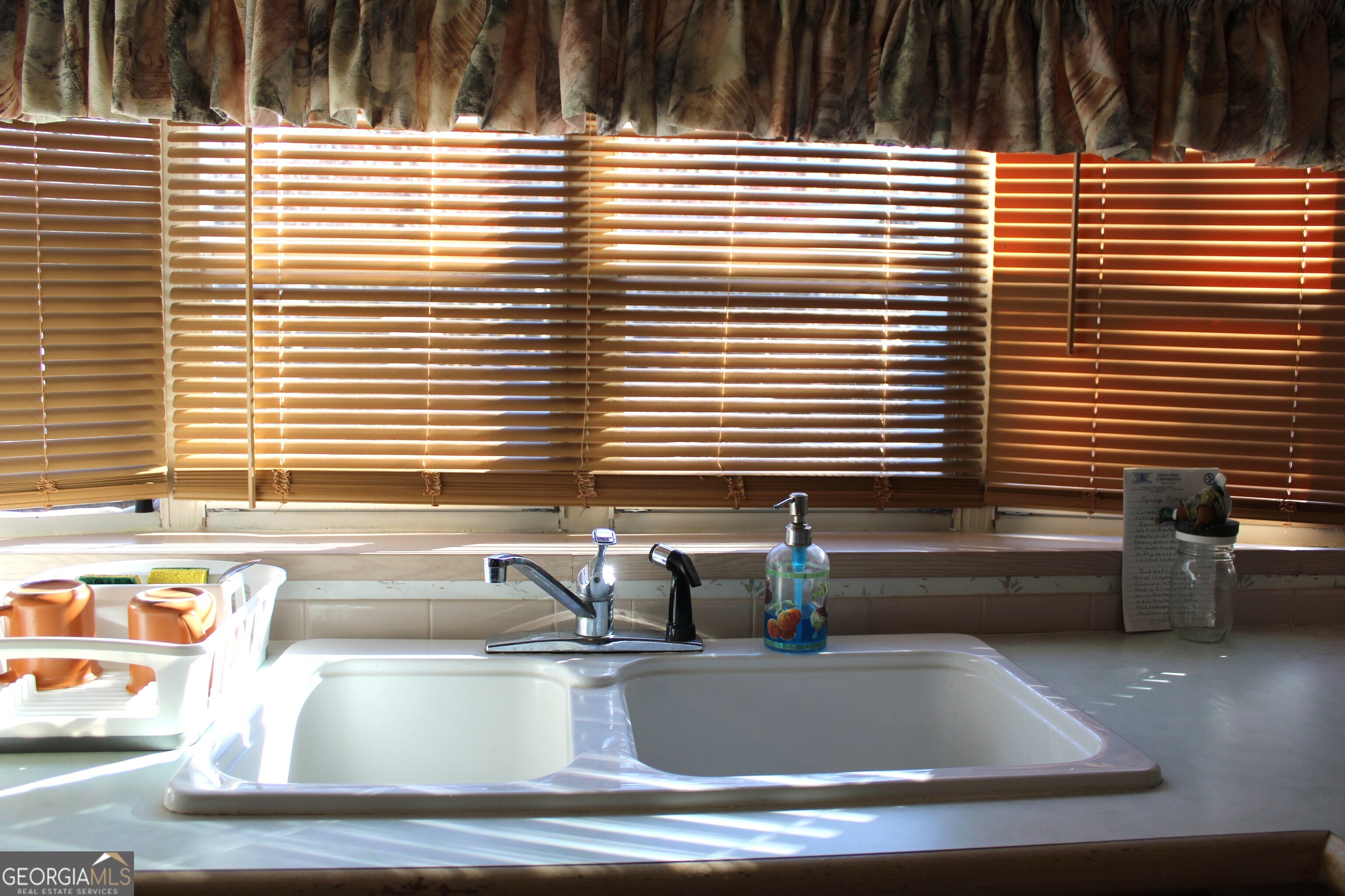 79 Maple Wood Lane Cleveland, GA 30528 - Photo 11 of 18 a view of a bathroom with a sink and bathtub