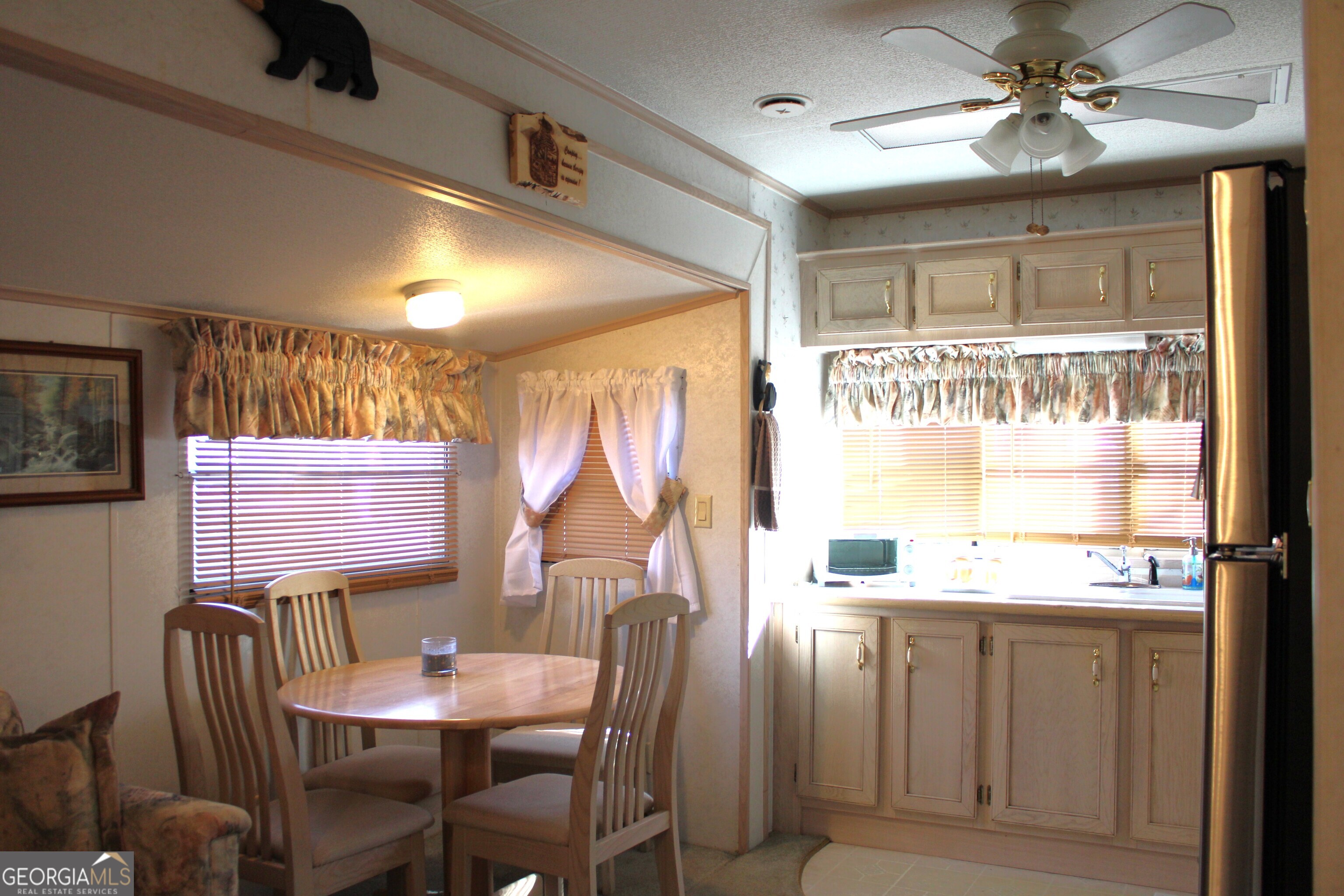 79 Maple Wood Lane Cleveland, GA 30528 - Photo 6 of 18 a view of a dining room with furniture window and outside view