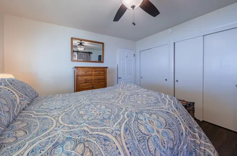 a bedroom with a bed and a dresser