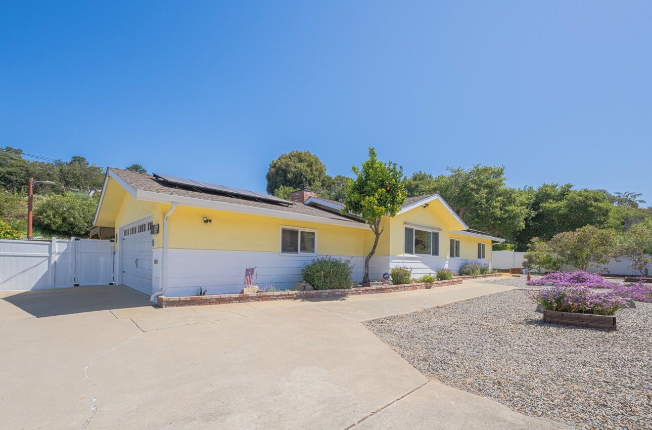 18101 Berta Canyon Road Salinas, CA 93907 - Photo 2 of 32 a front view of a house with a yard and garage