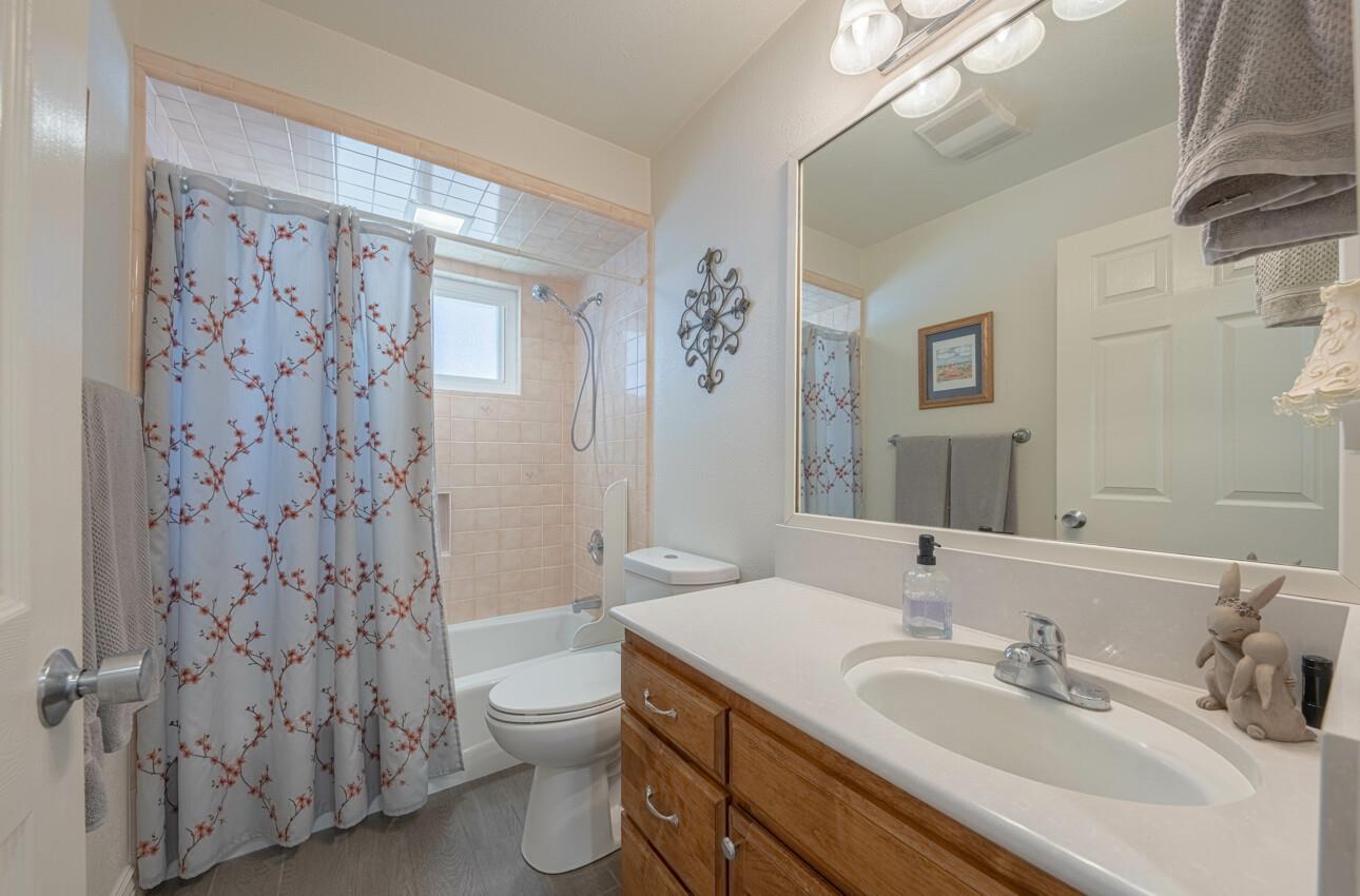 18101 Berta Canyon Road Salinas, CA 93907 - Photo 22 of 32 a bathroom with a sink toilet and shower
